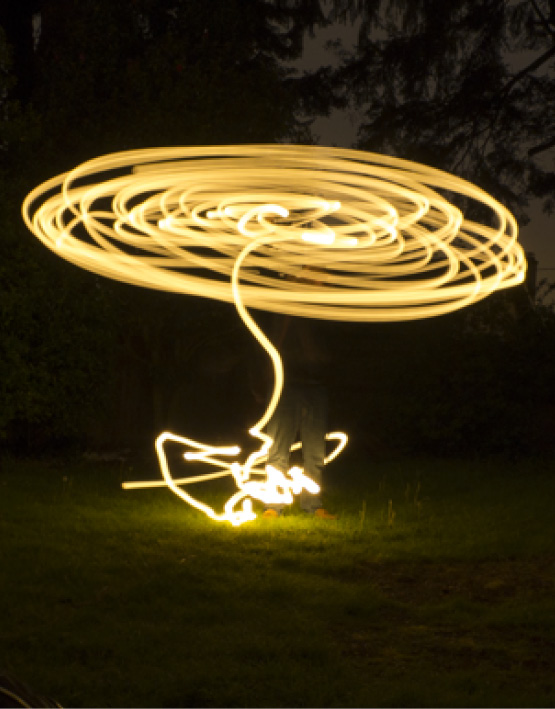 Light painting at night in the backyard